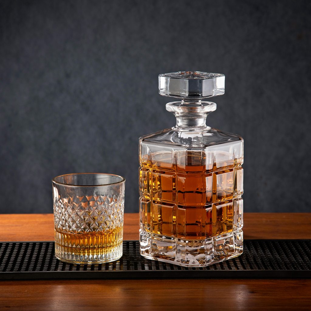 A glass and bottle of whisky
