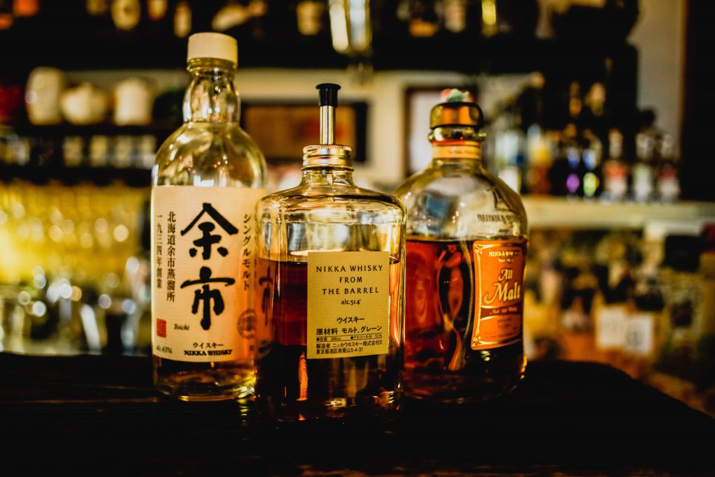 A selection of Japanese whiskies on a bar.