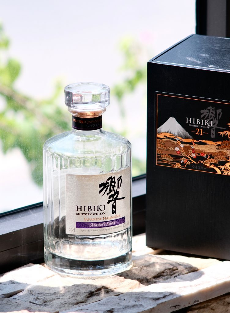 A bottle of Hibiiki whisky being showcased.