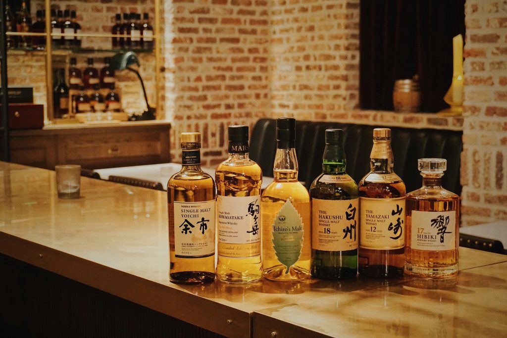 A range of Japanese whiskies shown on a bar.